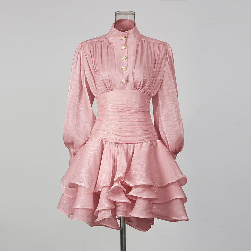 Pale pink shimmery long-sleeve high-neck mini dress with gold buttons, ruched waist and layered ruffle skirt