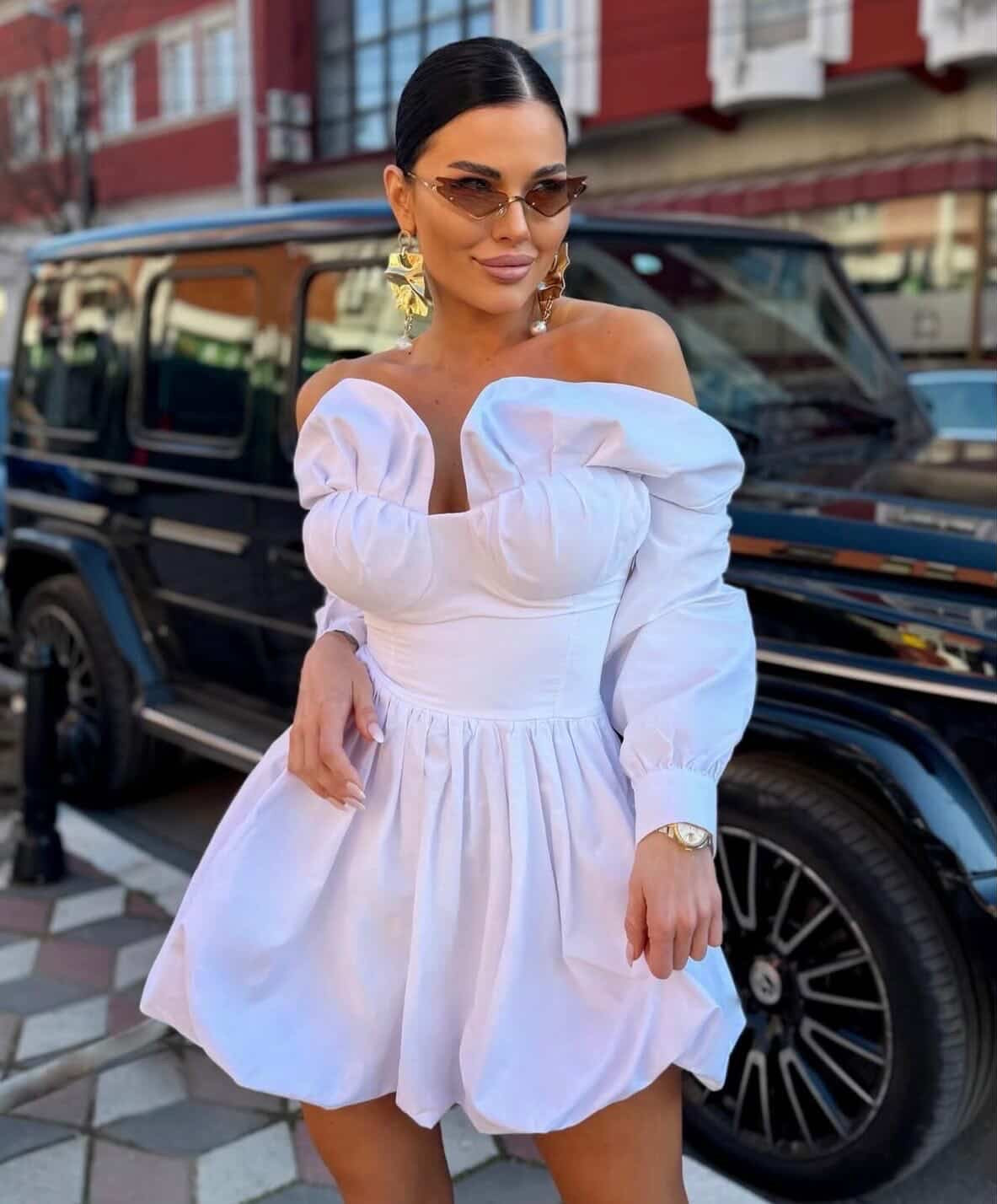 White off-shoulder corset-bodice mini dress with long puff sleeves and bubble pouf skirt