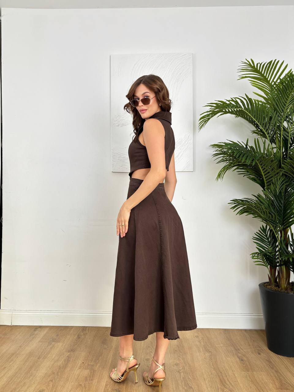 Brown two-piece: sleeveless collared open-back crop top + matching high-waisted flared midi skirt — back view