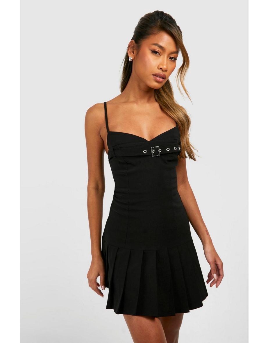 Black buckle-bust pleated drop-hem mini dress — full-length view