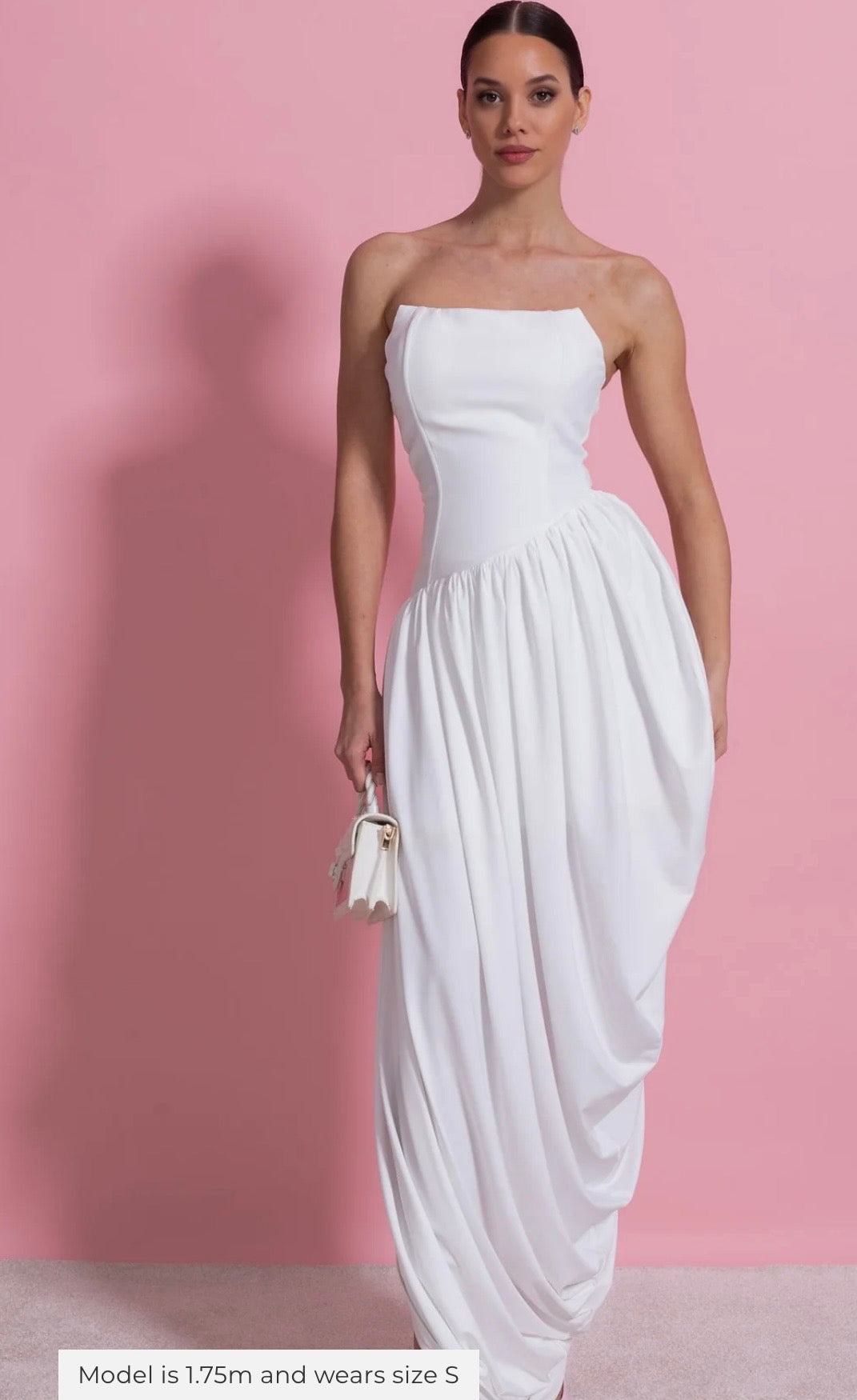 White strapless gown with fitted bodice and softly draped floor-length skirt