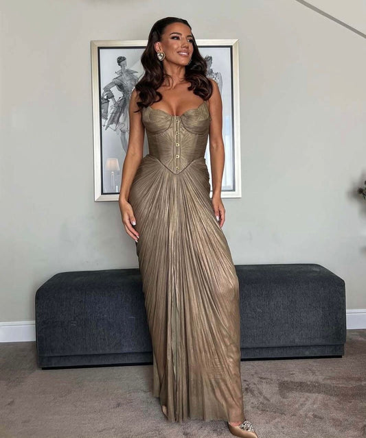 Gold metallic strapless corset-bodice gown with vertical pleated draped floor-length skirt